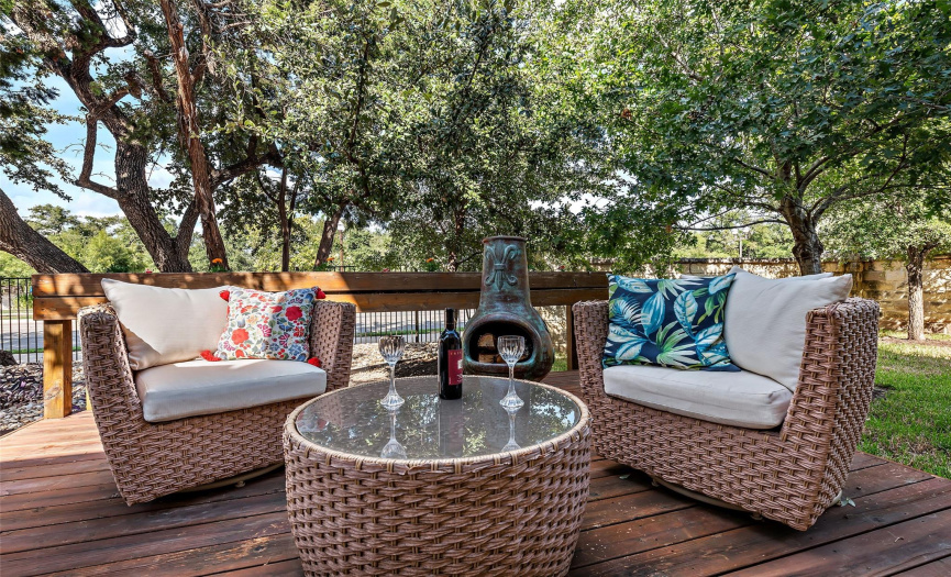 The back yard comes with a 12 x 12 tree covered deck perfect for relaxing or entertaining