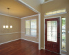 Upon entry there is a formal dining room to the left with chair rail and crown molding.