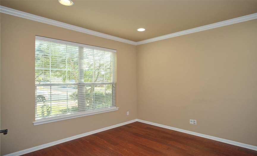 Executive office overlooks the front yard. This a great space for those working from home.