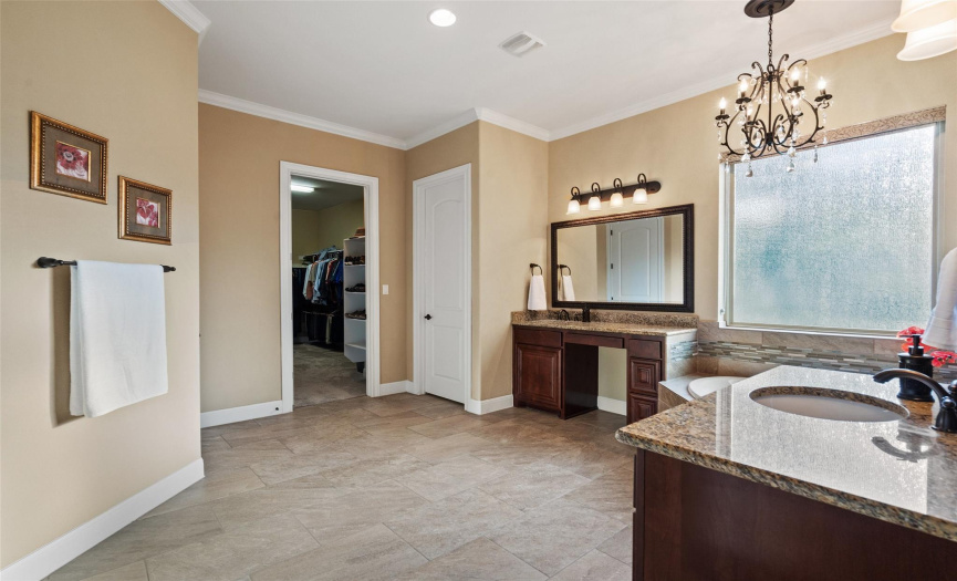 An extra large closet is accessed through the gigantic bathroom.