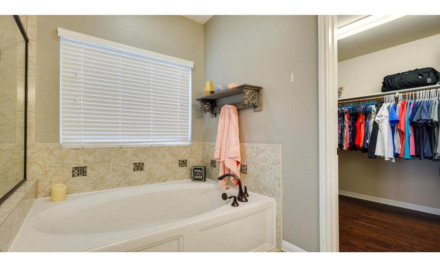 The ensuite is complete with a spacious walk-in closet.