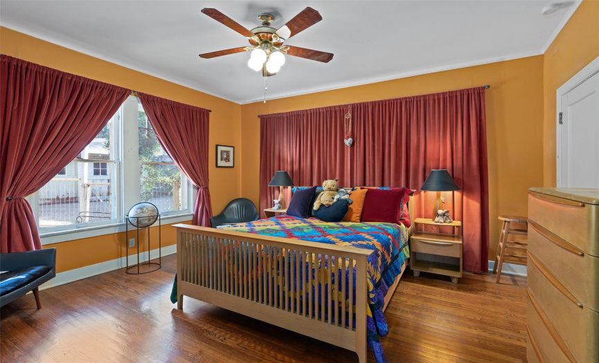 Spacious & inviting bedroom with beautiful custom velvet drapes