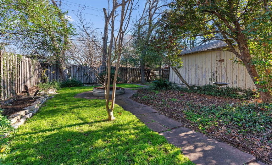 Enchanting fully fenced private back yard with alley access