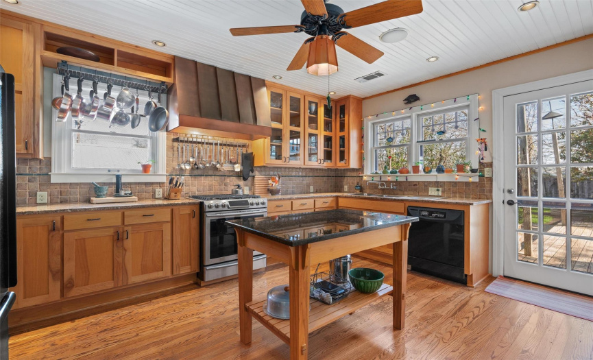 Completely renovated light & bright stately gourmet kitchen with oak flooring & wood ceiling