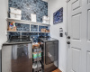 Wallpapered laundry adds depth to the space