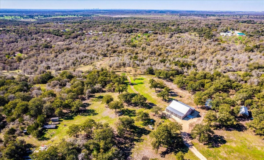 Aerial of Event barn & Cabins on the hilltop at Honeysuckle Ranch.
