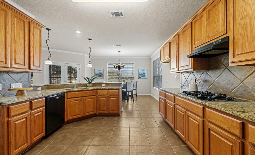 Abundant cabinetry provides endless storage space in the kitchen.