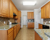 The kitchen is adorned with built-in appliances and granite counters.