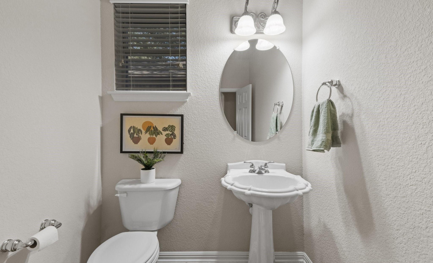 A main level powder room is conveniently located for guests.