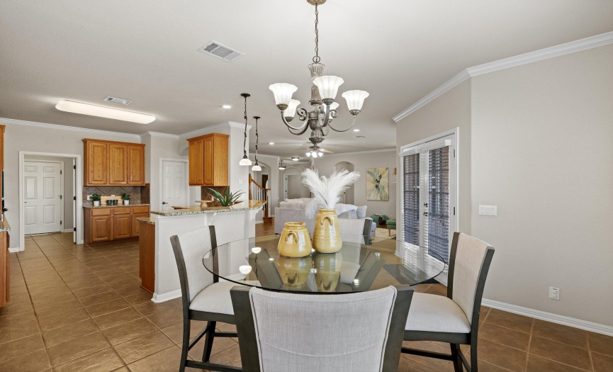 The breakfast nook offers a view of the kitchen and living room.