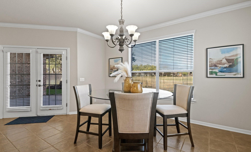 The windows along the back wall of the home offer captivating golf course views.