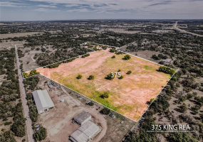 26 acres with two buildings with access to CR 255 and King Rea