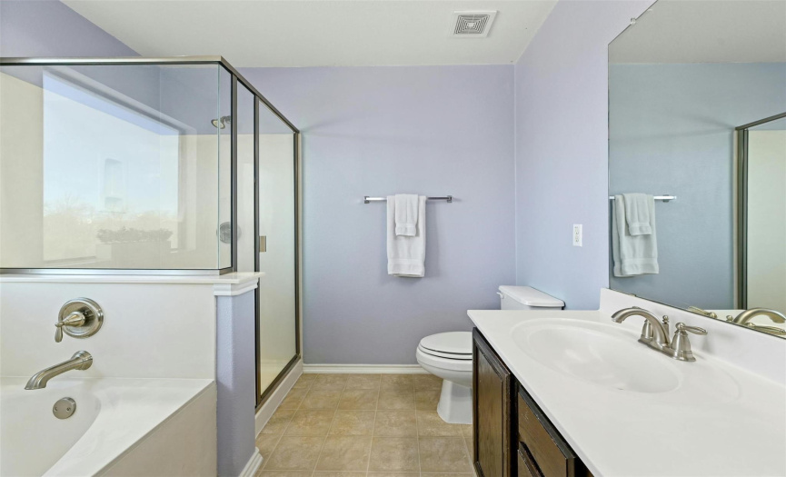 Enjoy your own private ensuite bath with a garden tub and separate standing shower. 
