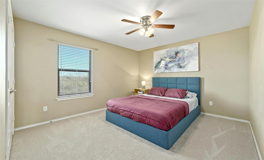 The other lovely secondary bedroom features wooded views. All of the bedrooms provide well maintained, cozy carpeting and great closet storage. 