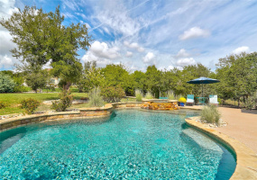 Dreamy Outdoor Living with a Sport's Pool, Spa and Waterfall.