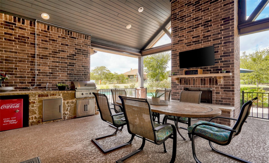 Oversized Outdoor Seating Area, Gas & Woodburning Fireplace, & Outdoor Kitchen.
