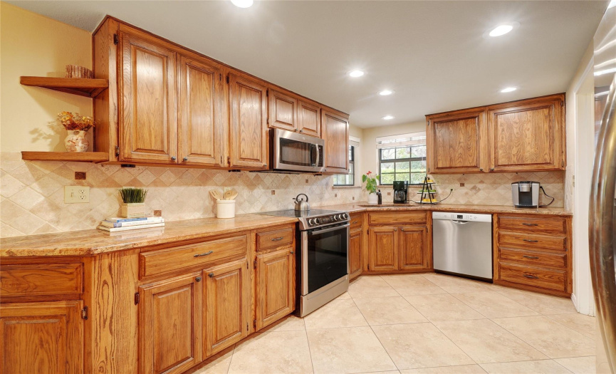 Gorgeous granite countertops and stainless steel Bosch appliances.