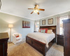 Large primary bedroom with crown molding.