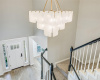 Chandelier by Jamie Young illuminates the foyer and stairs.