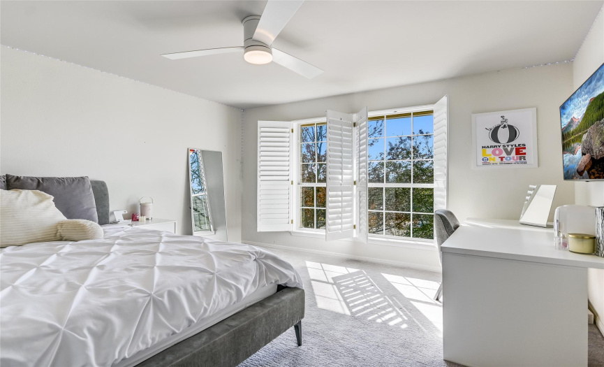 The white bedroom, large windows admit southeast light. California Closet system helps to keep things organized.