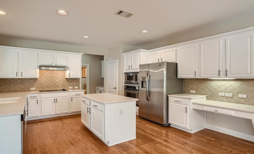 This amazing kitchen has a center island and tons of cabinet and counter space!