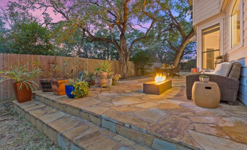 Relax and unwind on the stone patios surrounded by live oak trees.