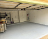 Clean-2 car garage with opener, and painted floor. 