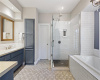 The primary bathroom with dual vanities, sizable walk-in shower and soaking tub. There are two walk-in closets with great storage. The luxurious bath also features handmade Resin countertops, custom cabinetry and designer fixtures.