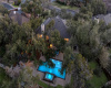 Aerial view of the backyard and back of the property.