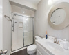 A guest bathroom near the kitchen with easy access from the pool outside.