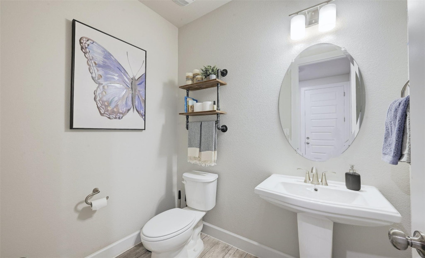 A main level powder room is conveniently located for guests, allowing the full bath to be kept private.