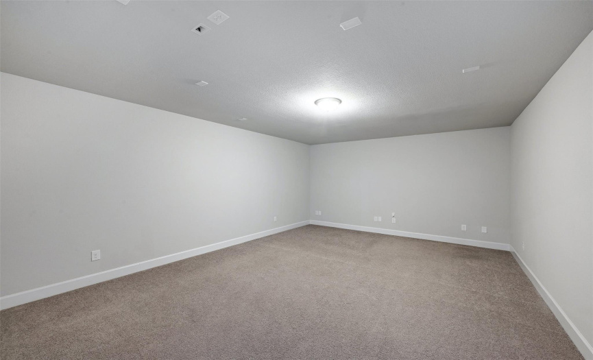 A separate media room is set upstairs, perfect for a home theater!