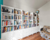 Wall-to-wall bookshelves convey with home.