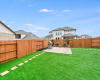 Super lovely backyard with artificial turf is great for children and pets!