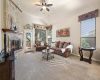 Warm and inviting family room with beautiful stone fireplace and views out the back windows