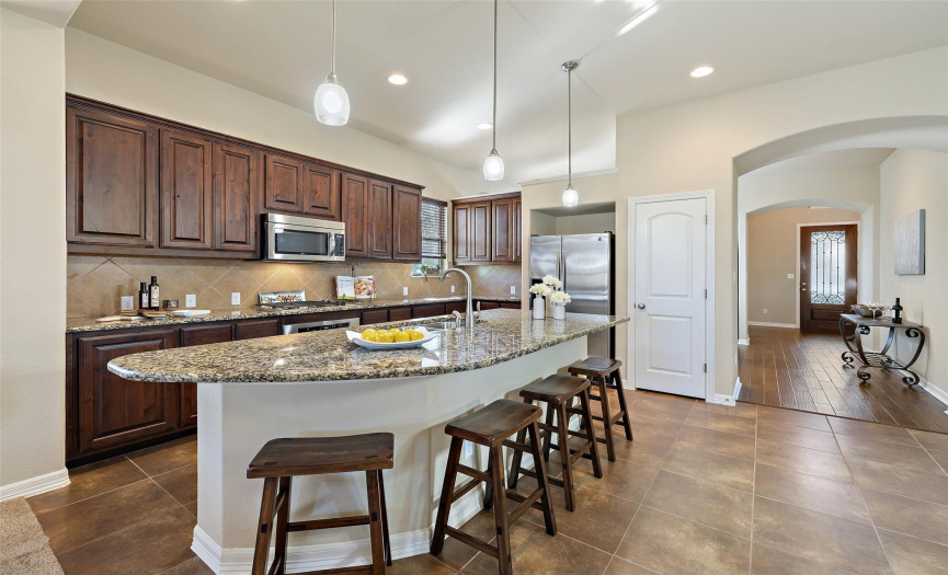 Pristine Kitchen with a spacious counter height breakfast bar