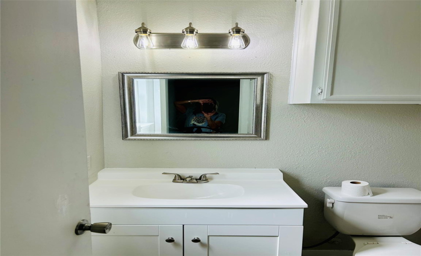 New master vanity, mirror, and light fixture