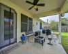 The covered patio with ceiling fan is the perfect place to relax and entertain.