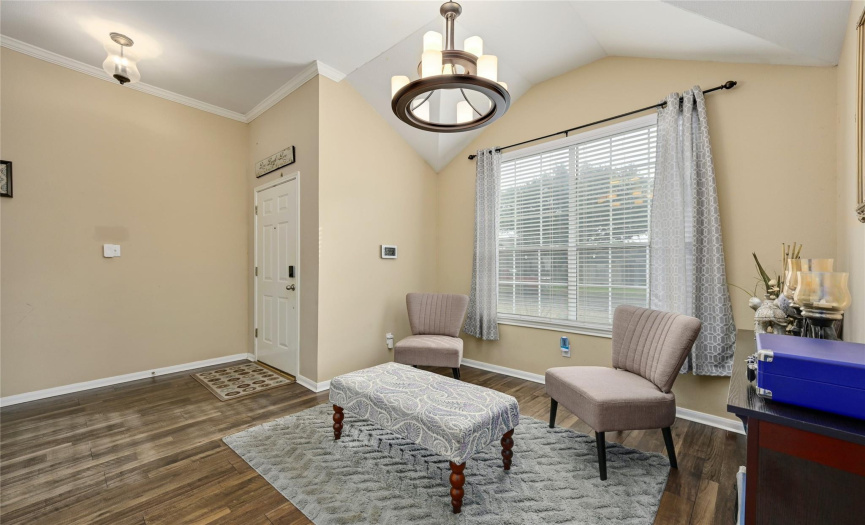 As you enter the front door, the living room is to your left. This would also be a great space for a piano, library or home office. High ceilings throughout the home make the space feel even bigger than its footprint.