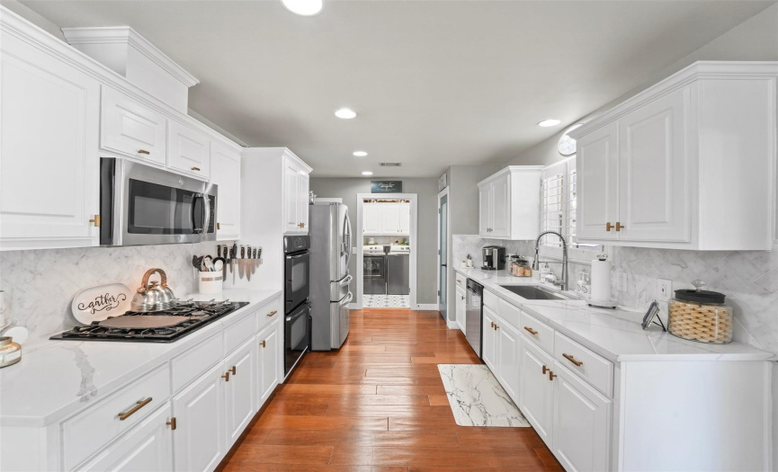 The chef will relish the updated kitchen with quartz countertops and stainless appliances.