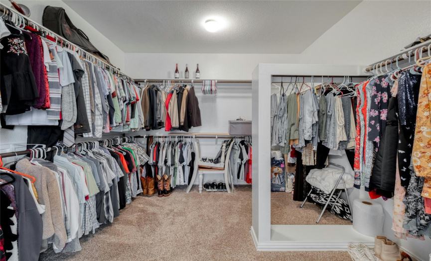 Plenty of space for all of your clothes and accessories in this oversized walk-in closet.