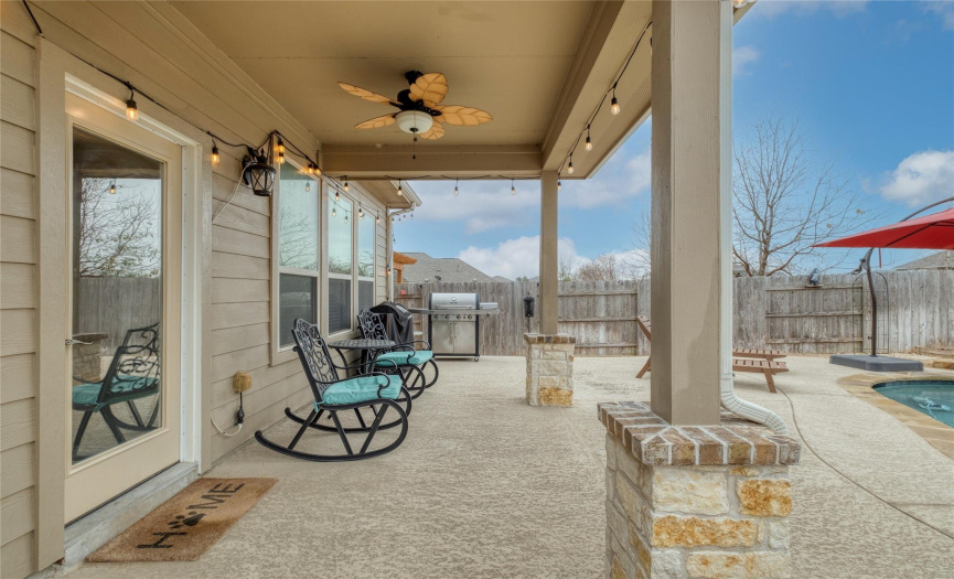 The backyard offers a covered patio with a ceiling fan, allowing you to enjoy lounging outside more than ever before.