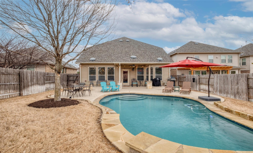 A look at the gorgeous walk-in pool and the back exterior of the home.