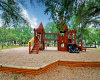 Playgrounds and swings for time outside with the little ones nicely set among the trees for character and shade.