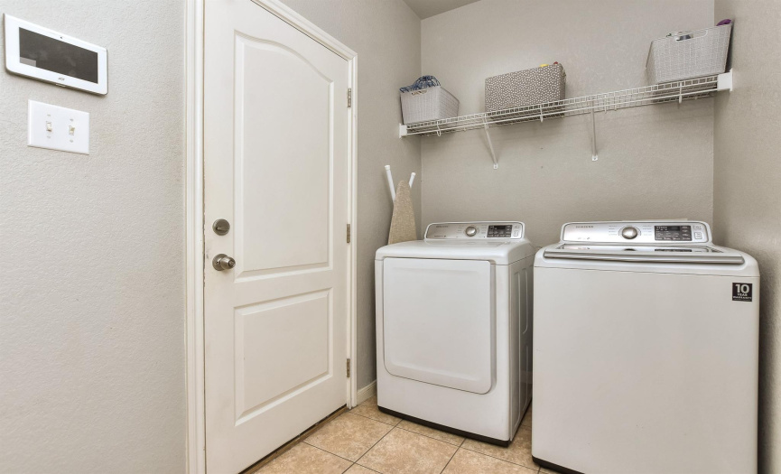 Laundry room is conveniently located on the first floor and by the garage.