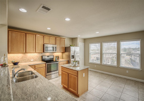Granite counters, stainless appliances, with island and under cabinet lighting! What a great kitchen to cook in!