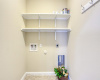 Laundry room offers extra shelving! 