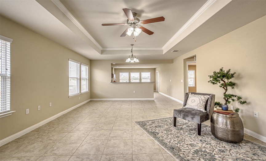 Tray ceiling adds an elegant feel to this living area. 