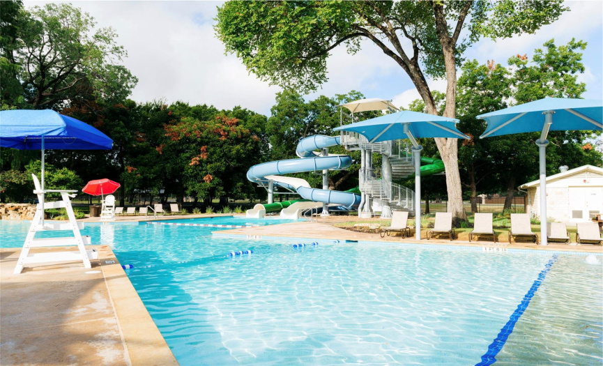 Resort-like pool with slide and splash pad