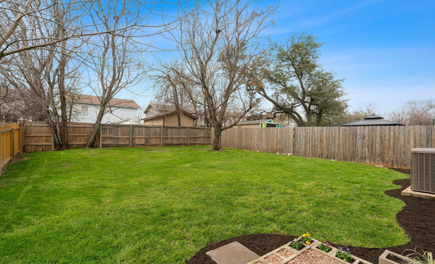 Large backyard perfect for pets, family, & entertaining